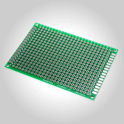 A bare drilled printed circuit board before component assembly